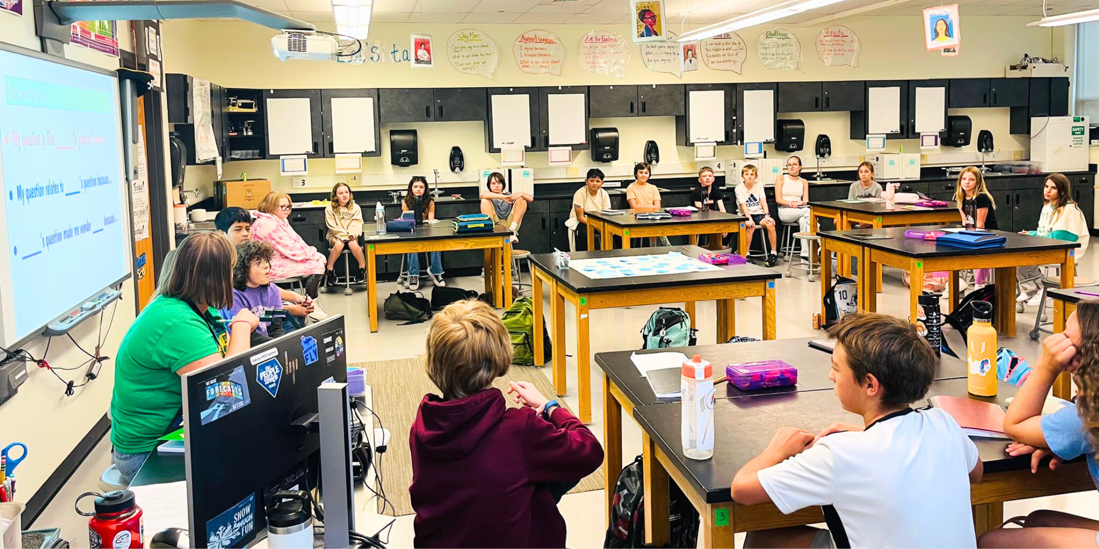 [PHOTO: 6 TH grade students ask thoughtful questions, create a Driving Question Board, and explore how their
questions are related to each other (OpenSciEd). CREDIT: @gretchenmilary / X]